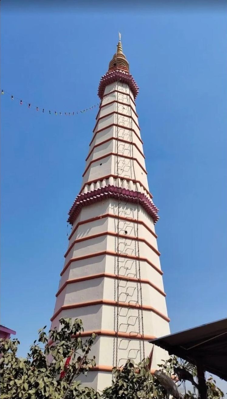 The shikhara of Baba Garibnath Dham rising against the sky